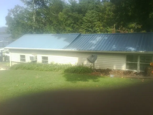 Blue metal roof running the length of a single story home in Villa Rica